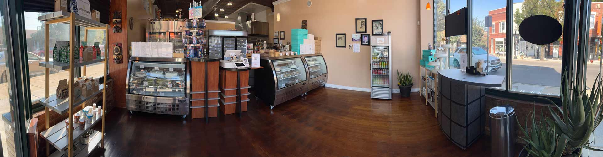 Panoramic interior view of store featuring the signature cake delivery.