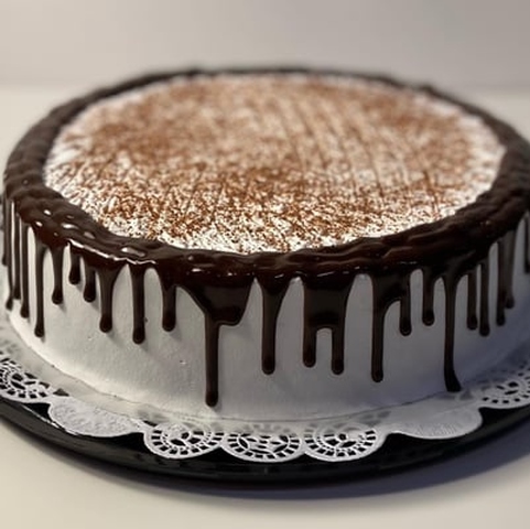 A cake with a frosting on top of it showcasing cake delivery.