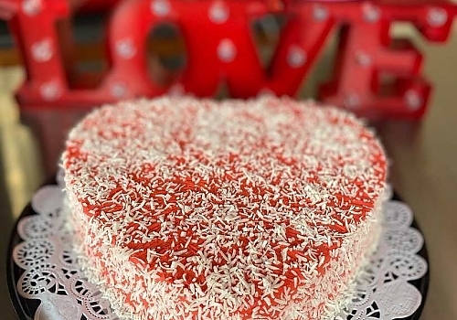 A cake with a frosting on top of it showcasing cake delivery.