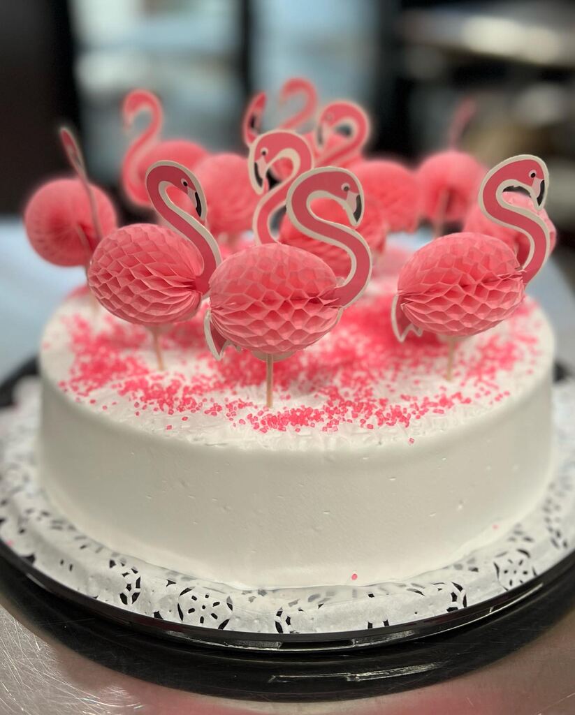 A cake with a bunch of frosting on it showcasing cake delivery.