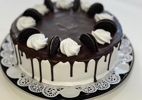 A piece of cake with a slice cut out of it showcasing wedding cakes.