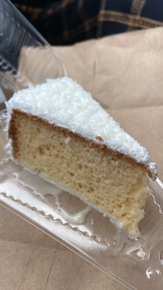 A piece of cake with frosting on it showcasing cappuccino tres leches.